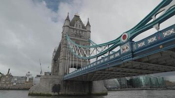 People crossing the Tower Bridge bascule and suspension bridge over River Thames London, United Kingdom video