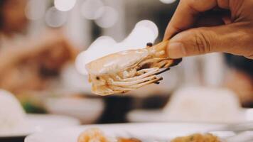 Shrimp in hand is prepared for cooking. video