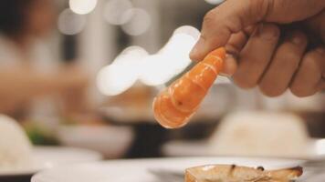 Shrimp in hand is prepared for cooking. video