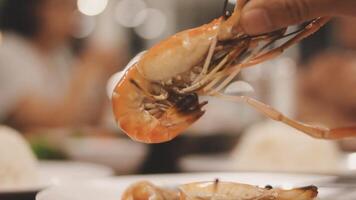 Shrimp in hand is prepared for cooking. video