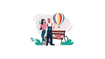 en man och kvinna är Sammanträde på en bänk med en varm luft ballong video