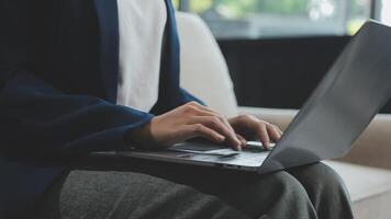 Woman working at home office hand on keyboard close up video