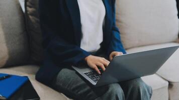 Woman working at home office hand on keyboard close up video