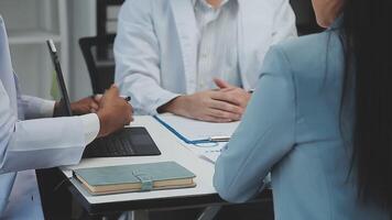 Staff, doctors and nurses with tablet, research and brainstorming for diagnosis. Team, medical professionals and teamwork for cure, discussion and talking for healthcare, analysis and conversation video