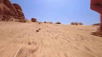 Point of view POV two hikers walk in Wadi Rum valleys in extreme heat together explore Jordan desert video