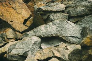 Large pile of stones. Stone rocks. Granite quarry. Abandoned industrial production. photo