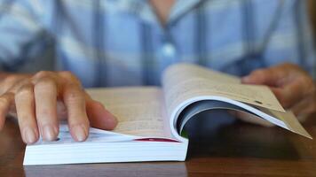 Asian senior old woman is reading book. video