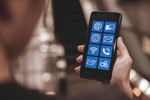 Service applications on smartphones with contact us service hotline, Address, phone number, email, and chat. concept of customer service department providing Troubleshoot and answer questions photo