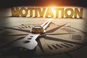 Compass points to motivation. concept of finding motivation and key to transforming yourself to success. photo