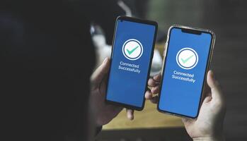 Businessman using smartphone for connect successfully to network signal. Concept of digital data exchange technology, remote control system connection photo