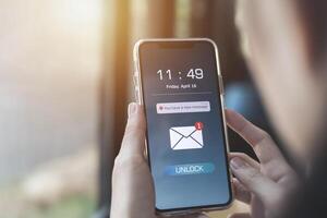 Electronic mail. Notification of new message inbox on mobile phone. concept of Marketing and business by emails, newsletters, and online internet coordination photo