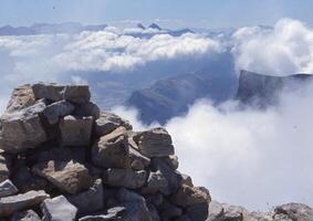 a mountain with clouds photo