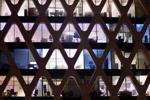 Modern office building at night. Night lights, city office building downtown, cityscape view photo