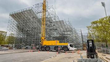 Extensive scaffolding with mobile crane at a large construction site, symbolizing infrastructure development and urban construction photo