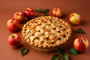 rustic apple pie and fresh apples isolated on a brown gradient background photo