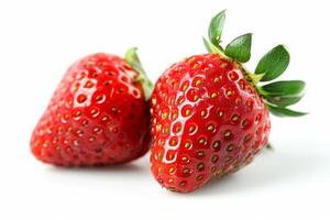 couple of vibrant red strawberries isolated on a white background photo