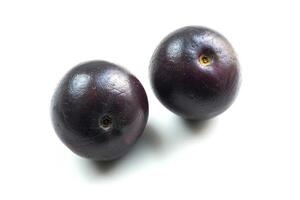 two acai berries, top view, vivid and distinct on a white background photo