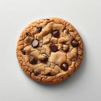 Chocolate chip cookie isolated on white background with shadow. Chocolate chip cookie top view. Cookie and dough with chocolate pieces flat lay photo