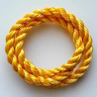 Yellow rope isolated on white background with shadow. Yellow cord rope photo