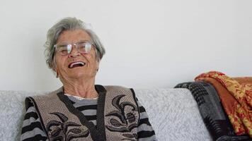 Old woman with mental health problems due to old age smiles video