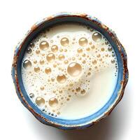 Milk in cup isolated. Cow milk full of calcium top view. Almond milk as vegan option. Oat milk photo