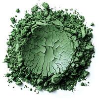 Green powder isolated on white background with shadow. Green powder pigment top view. Green powder for eyeshadow use photo