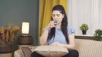 Woman drinking water for healthy life. video