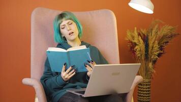 Young woman with notebook thinks and takes notes. video