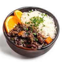 Brazilian feijoada with rice and orange slices isolated on a white background photo