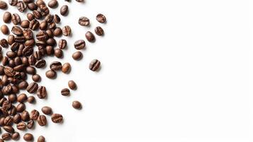 Top view of scattered coffee beans, isolated on a white background with space for text photo