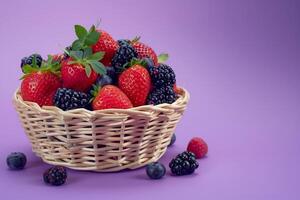 basket of mixed berries isolated on a purple gradient background photo