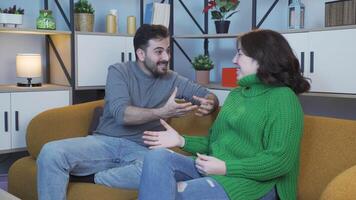 Happy lovers chatting at home. video
