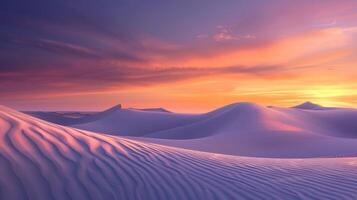 Sunrise paints unusual fractal patterns on undulating desert sand dunes with a vibrant orange and purple gradient sky as backdrop photo