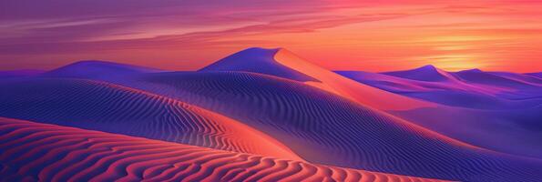 Sunrise paints unusual fractal patterns on undulating desert sand dunes with a vibrant orange and purple gradient sky as backdrop photo