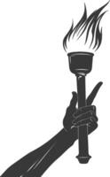 Silhouette hand holding burning torch black color only vector