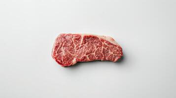A single piece of Wagyu beef steak, raw and marbled, isolated on white background photo