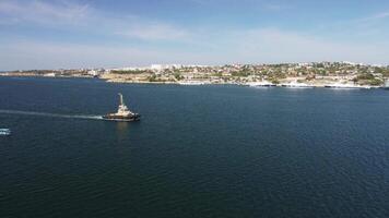 Sea bays of Sevastopol in Crimea during summertime in sunny weather. The aerial drone panoramic view an array of ships and boats, seaside tourism and travel destinations. video