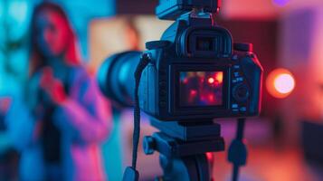 Professional DSLR camera on a tripod capturing a blurred woman in a vibrant neon lit setting, suitable for photography workshops and World Photography Day themes photo