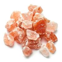 Himalayan salt crystals, pink and irregular shapes, isolated on white background photo