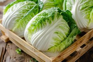 Fresh Napa cabbages in a wooden crate, perfect for culinary concepts, healthy eating, and related to Asian cuisine and cultural celebrations like the Korean Kimjang photo