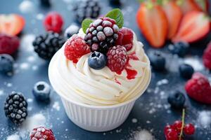 Delectable vanilla cupcake topped with fresh berries and a mint leaf, perfect for summer picnics and 4th of July celebrations, on a dark slate background photo
