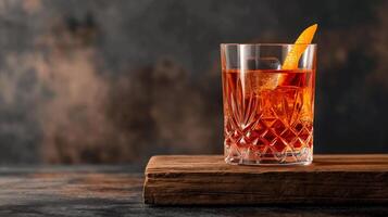 Classic Negroni cocktail with orange peel garnish on a rustic wooden board, concept for Fathers Day or International Bartender Day photo