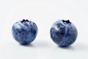 two bilberries, clear focus, isolated on a pristine white background photo