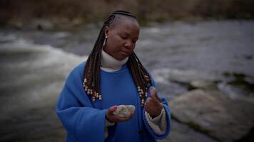 One Female Person Holding Stones In Hand Shot in Slow Motion video