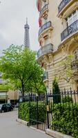 Springtime in Paris with a view of the Eiffel Tower and classic French architecture, captured on April 14th, 2024, ideal for travel and holiday themes photo
