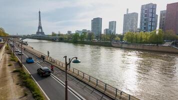 Springtime in Paris, France, with a clear view of the Seine River and Eiffel Tower, cityscape and traffic on April 14th, 2024, ideal for travel and culture themes photo