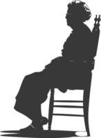 Silhouette elderly woman sitting in the chair black color only vector