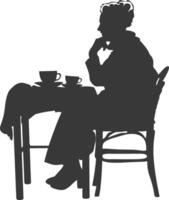 Silhouette elderly woman sitting at a table in the cafe vector