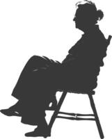 Silhouette elderly woman sitting in the chair black color only vector