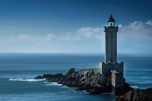 on theme of large retro lighthouse with beam of bright light shining out to blue sea photo